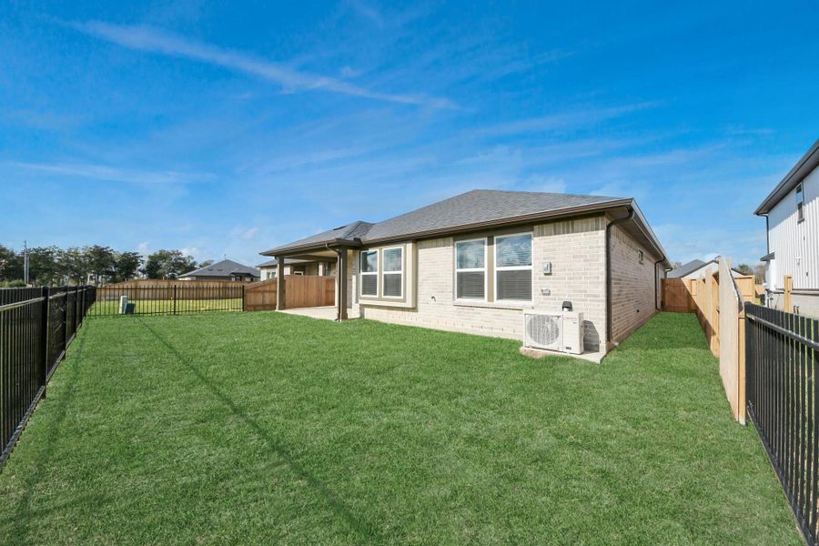 Exterior details and patio area of a home in Laurel Landing: Landmark Collection, Alvin (Image 26). Exterior details and patio area of a home in Laurel Landing: Landmark Collection, Alvin (Image 26).