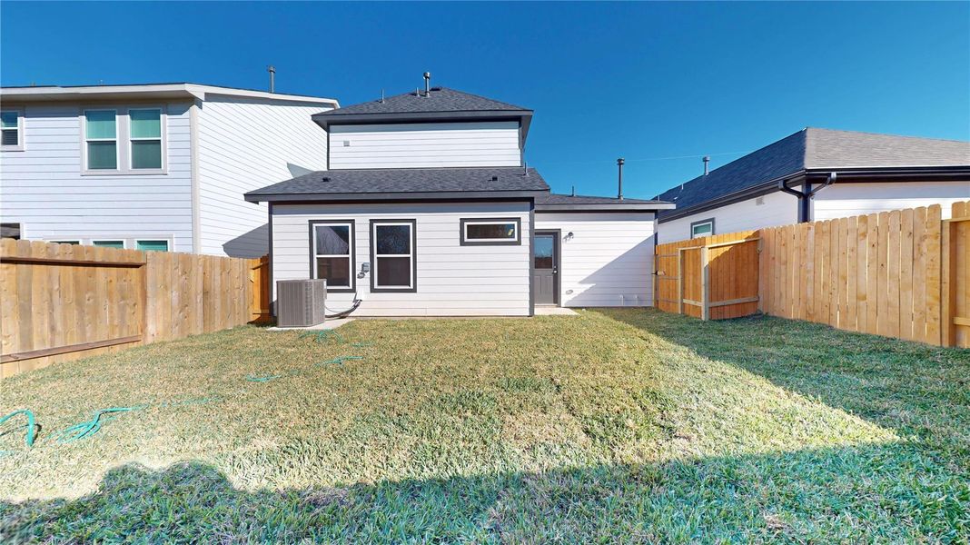 Exterior details and patio area of a home in East Gate Villas, Willis (Image 25).