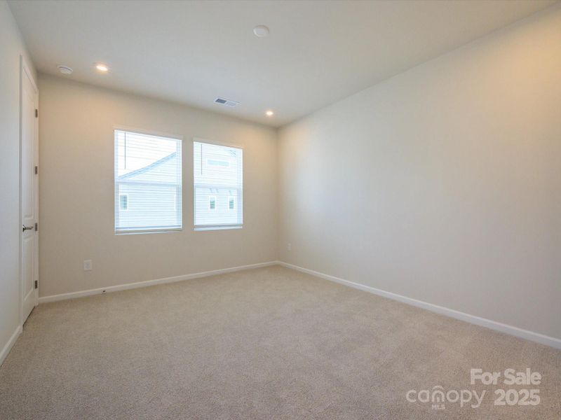 Primary Suite with Large Windows and Oversized Walk-In Closet.