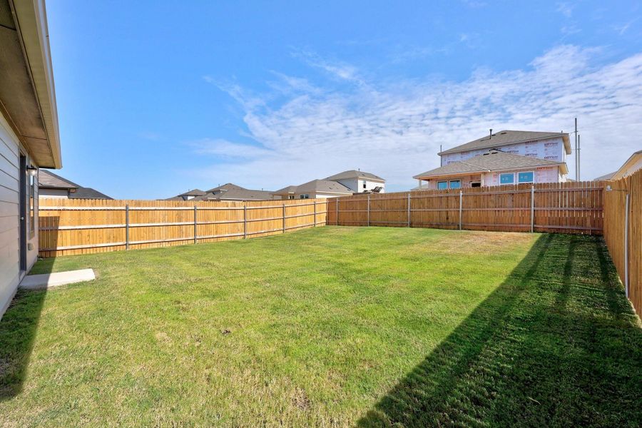 Front exterior of a new home in Trinity Ranch, Elgin, TX, highlighting curb appeal (Image 24). Front exterior of a new home in Trinity Ranch, Elgin, TX, highlighting curb appeal (Image 24).