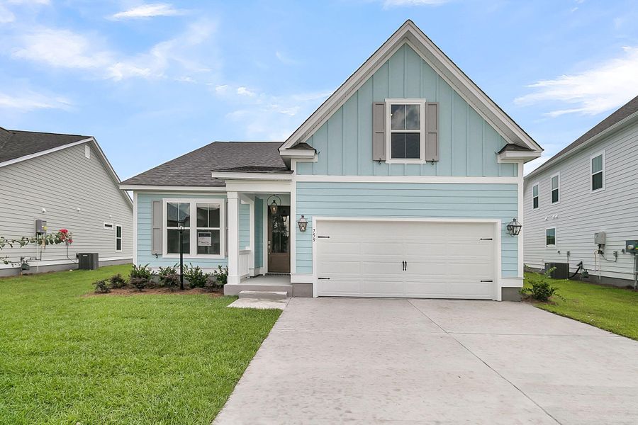 Front exterior of a new home in Tidewater at Lakes of Cane Bay, Summerville, SC, highlighting curb appeal (Image 1).