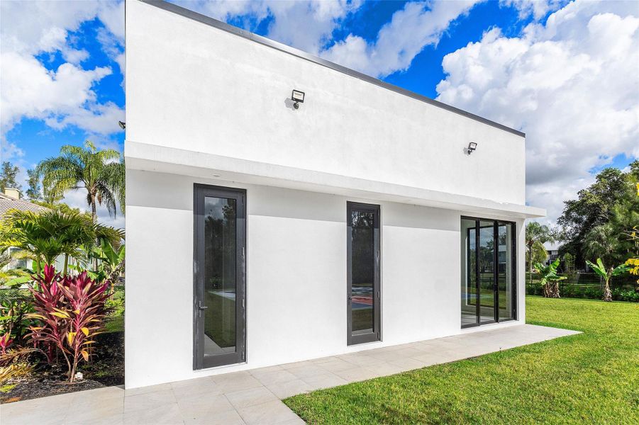 Exterior details and patio area of a home in , Parkland (Image 27).