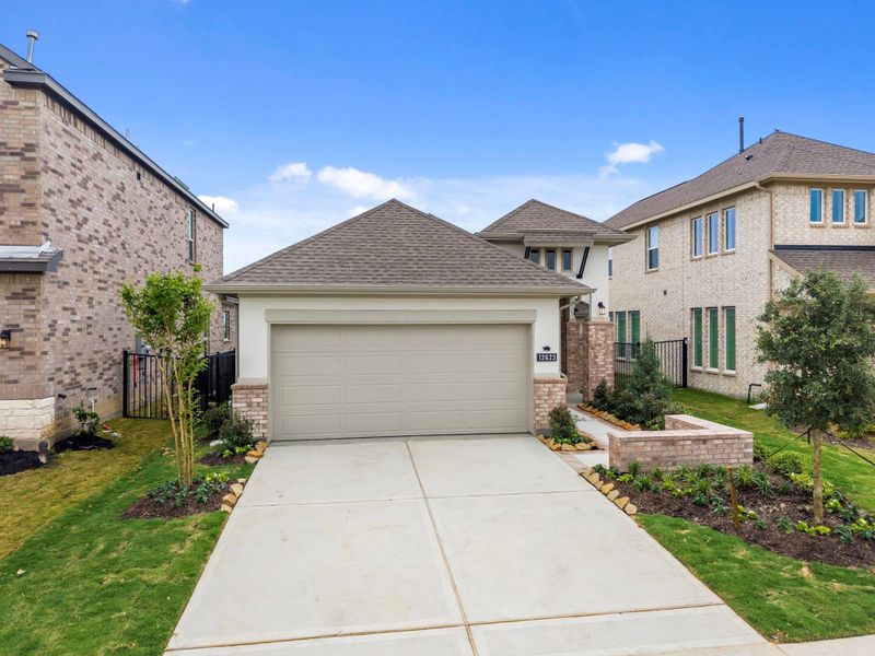 Front exterior of a new home in Bridgeland, Cypress, TX, highlighting curb appeal (Image 21).
