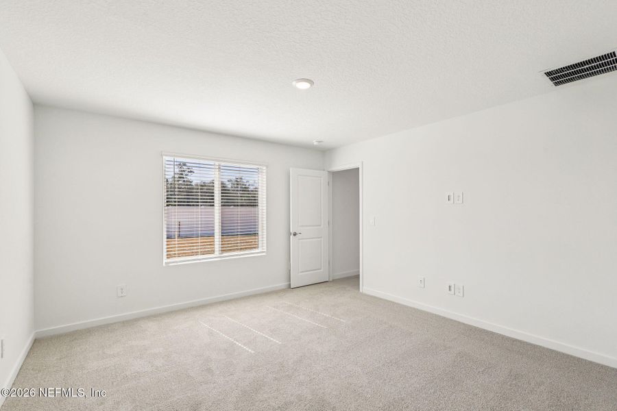 Spacious, unfurnished interior of a new home in Colbert Landings, Palm Coast (Image 30).