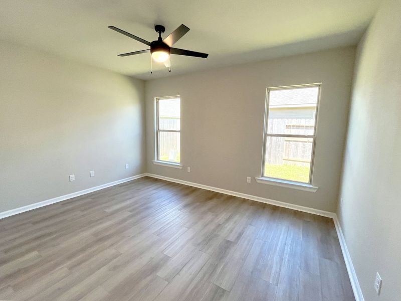 Front exterior of a new home in Emberly, Beasley, TX, highlighting curb appeal (Image 13).