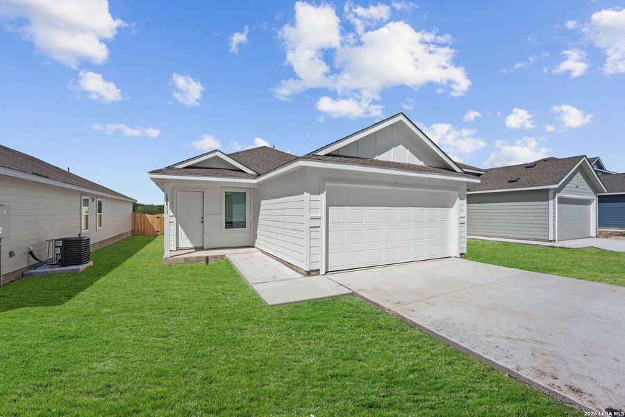 Front exterior of a new home in Hidden Oasis, San Antonio, TX, highlighting curb appeal (Image 1). Front exterior of a new home in Hidden Oasis, San Antonio, TX, highlighting curb appeal (Image 1).