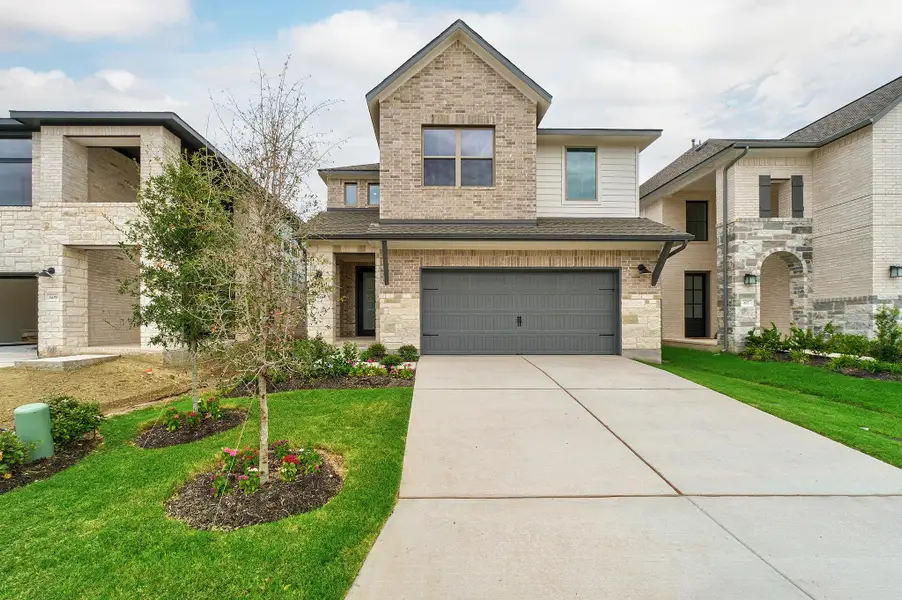 Front exterior of a new home in Parmer Ranch, Georgetown, TX, highlighting curb appeal (Image 2). Front exterior of a new home in Parmer Ranch, Georgetown, TX, highlighting curb appeal (Image 2).