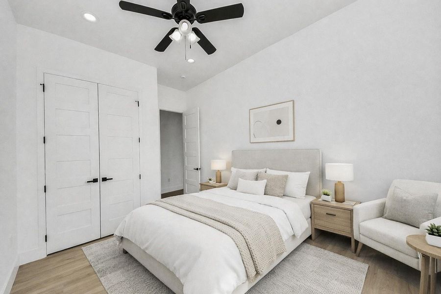 Bright guest bedroom with abundant natural light and a clean, modern feel.
