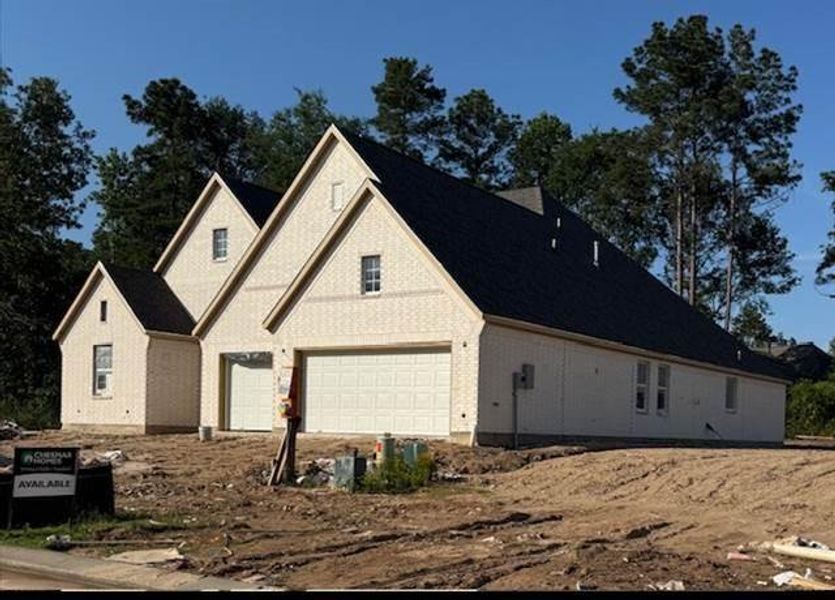 Front exterior of a new home in Evergreen 60', Conroe, TX, highlighting curb appeal (Image 24).