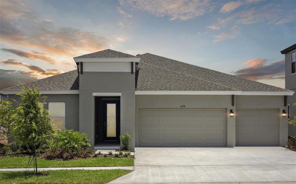 Front exterior of a new home in Waterset, Apollo Beach, FL, highlighting curb appeal (Image 17).