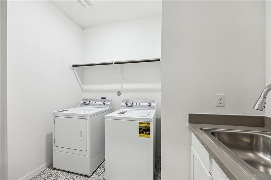 The laundry room downstairs is equipped with a convenient sink, enhancing its functionality. This added feature is perfect for rinsing out delicate items, washing hands after handling laundry, or tackling those messy clean-up tasks. With ample counter space and storage for supplies, the laundry room becomes a practical hub for managing your household chores. Please remember that the washer and dryer will be moved out prior to closing, giving you the chance to customize the space with your preferred applianc