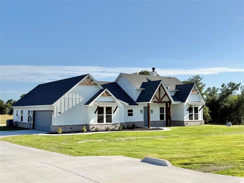 Front exterior of a new home in , Weatherford, TX, highlighting curb appeal (Image 16).