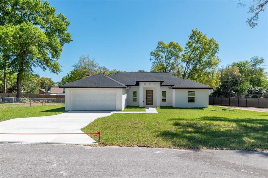 Front exterior of a new home in , Belleview, FL, highlighting curb appeal (Image 25). Front exterior of a new home in , Belleview, FL, highlighting curb appeal (Image 25).