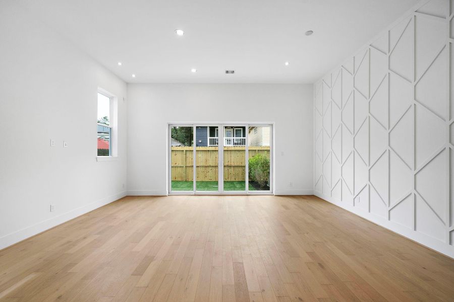 Living/dining area with 12-foot ceilings, great natural light, and a sizable backyard with artificial turf, perfect for entertaining. (Photos are of a previously completed home. Finishes are subject to change.) Living/dining area with 12-foot ceilings, great natural light, and a sizable backyard with artificial turf, perfect for entertaining. (Photos are of a previously completed home. Finishes are subject to change.)