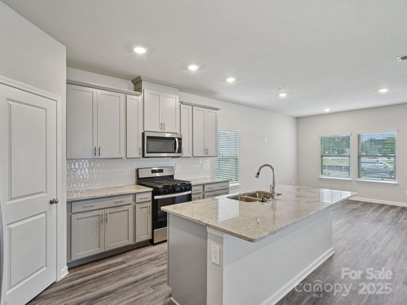 Photo is not of the actual home, but is an inspirational photo of builder’s model home and may depict options, furnishings, and/or decorator features that are not included