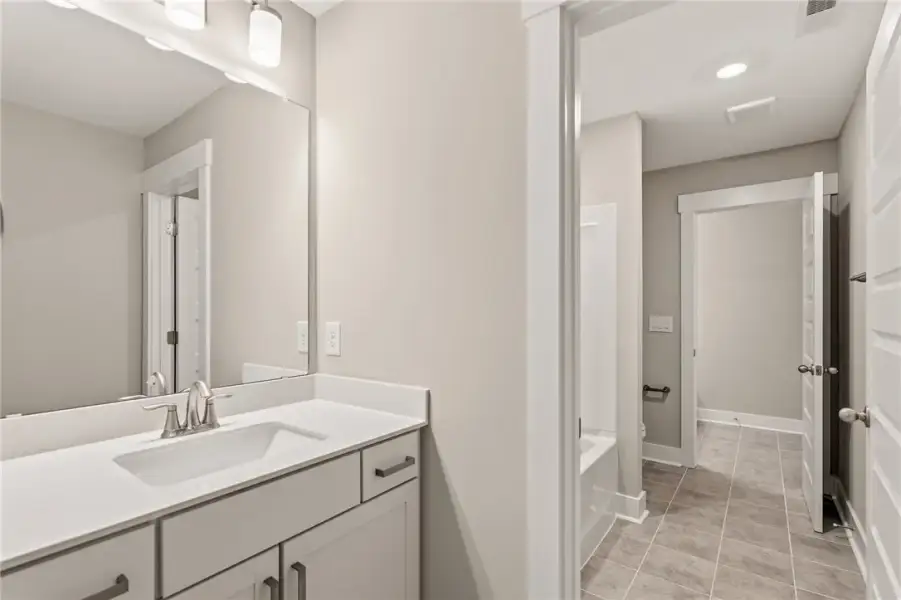 A well-appointed bathroom features a crisp white v A well-appointed bathroom features a crisp white v