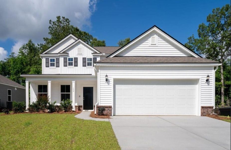 Front exterior of a new home in Cedar Glen Preserve, Huger, SC, highlighting curb appeal (Image 2). Front exterior of a new home in Cedar Glen Preserve, Huger, SC, highlighting curb appeal (Image 2).