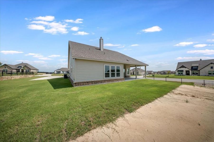 Back of house with a chimney Back of house with a chimney