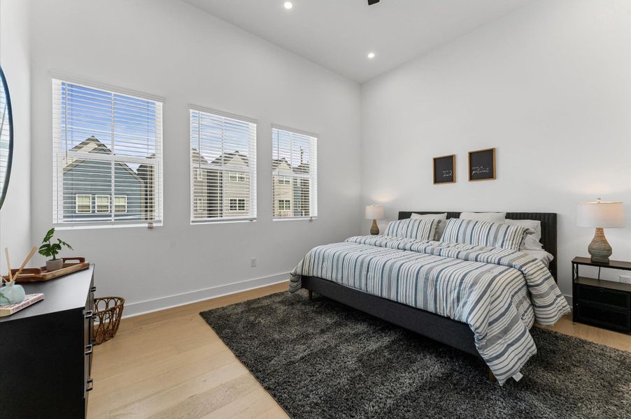 Bright and spacious, the primary bedroom features multiple windows, a large walk-in closet, and a luxurious primary bathroom... your private retreat.