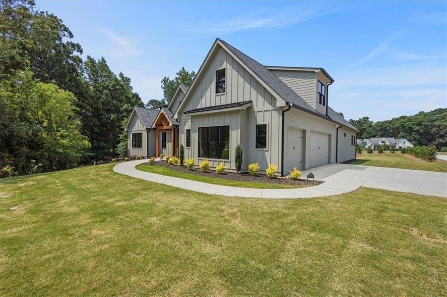 Front exterior of a new home in , Gainesville, GA, highlighting curb appeal (Image 2). Front exterior of a new home in , Gainesville, GA, highlighting curb appeal (Image 2).