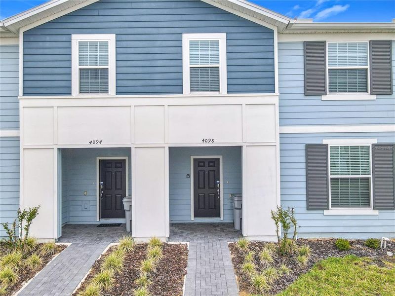 Front exterior of a new home in , Davenport, FL, highlighting curb appeal (Image 1).