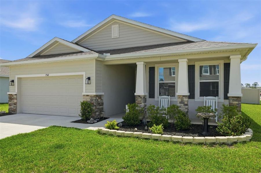 Front exterior of a new home in Waterford, Brooksville, FL, highlighting curb appeal (Image 22).