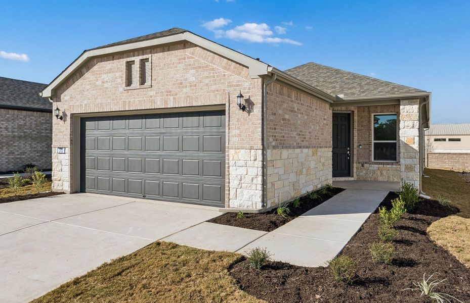 Front exterior of a new home in Sun City Texas, Georgetown, TX, highlighting curb appeal (Image 19).