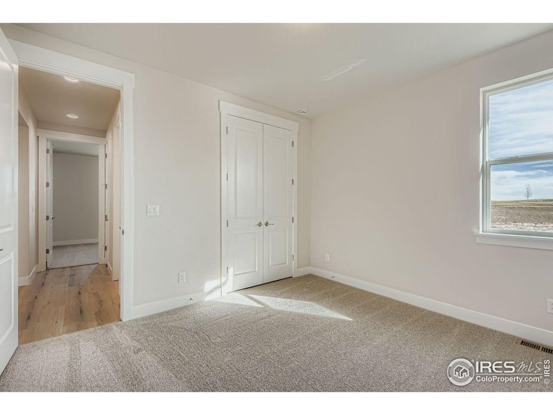 Spacious, unfurnished interior of a new home in RainDance National 60/70, Windsor (Image 16).