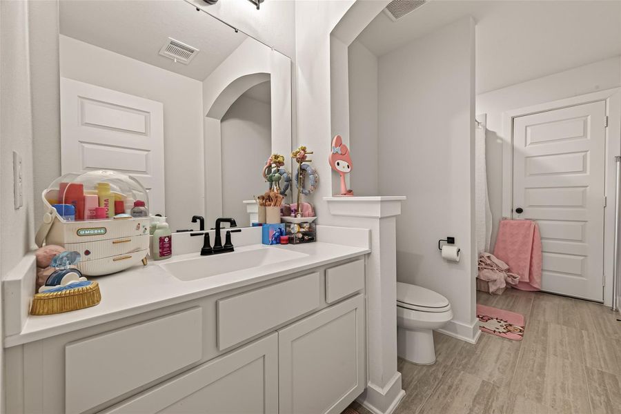 The secondary bathroom features a spacious vanity with plenty of storage. The secondary bathroom features a spacious vanity with plenty of storage.