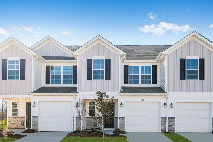 Front exterior of a new home in Kings Crossing: Timber, King, NC, highlighting curb appeal (Image 1). Front exterior of a new home in Kings Crossing: Timber, King, NC, highlighting curb appeal (Image 1).