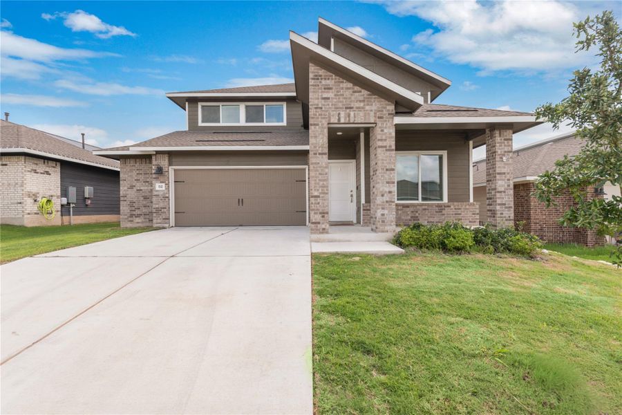 Front exterior of a new home in Plum Creek North, Kyle, TX, highlighting curb appeal (Image 1). Front exterior of a new home in Plum Creek North, Kyle, TX, highlighting curb appeal (Image 1).