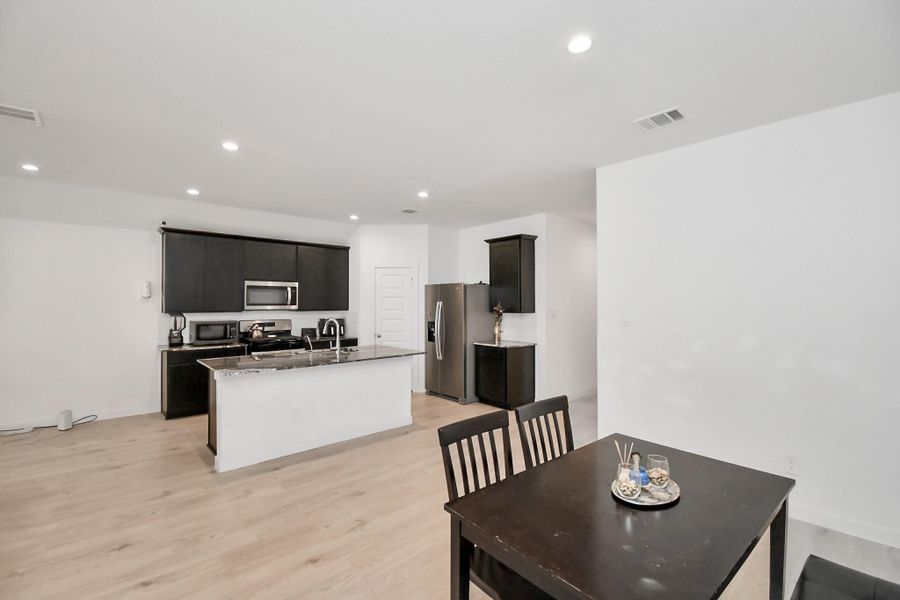 Furnished interior view inside a new home in Post Oak Pointe, Fresno (Image 17).