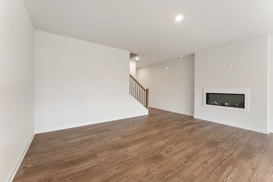 A room with a wood floor and a wood floor.
