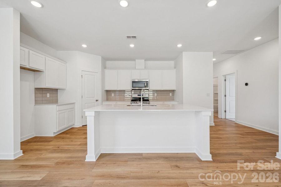 Furnished interior view inside a new home in Meadow Creek Village, Locust (Image 4).