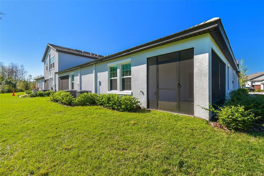 Front exterior of a new home in Angeline Active Adult, Land O' Lakes, FL, highlighting curb appeal (Image 22).