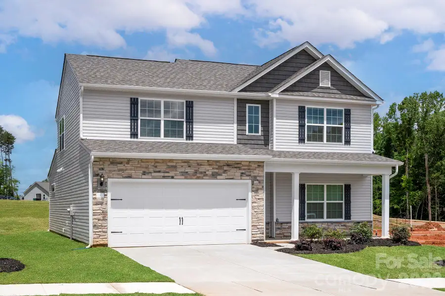 Front exterior of a new home in Ascot Woods, Charlotte, NC, highlighting curb appeal (Image 1). Front exterior of a new home in Ascot Woods, Charlotte, NC, highlighting curb appeal (Image 1).