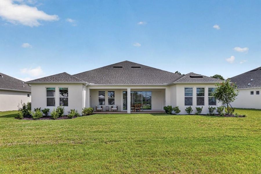 Exterior details and patio area of a home in Ardisia Park, New Smyrna Beach (Image 28).