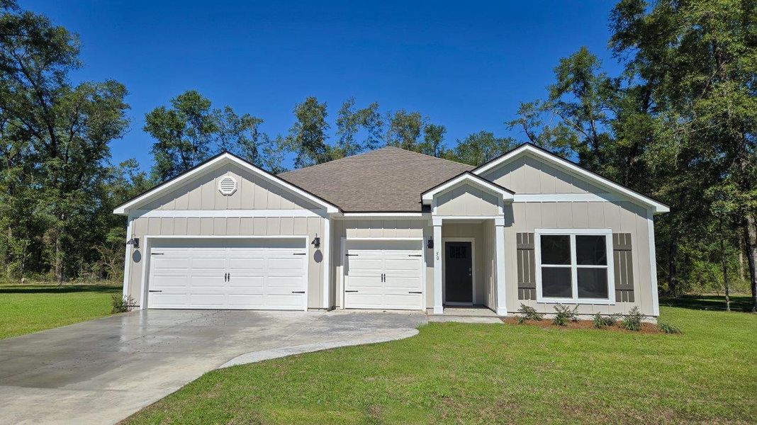 Front exterior of a new home in Greystone, Crawfordville, FL, highlighting curb appeal (Image 1). Front exterior of a new home in Greystone, Crawfordville, FL, highlighting curb appeal (Image 1).
