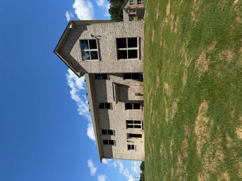 Front exterior of a new home in Underwood Crossing, Covington, GA, highlighting curb appeal (Image 13).