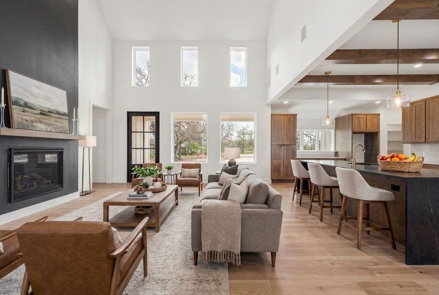 High ceilings, abundant natural light from expansive windows, and an open floor plan all contribute to the charm and comfort of this delightful home.