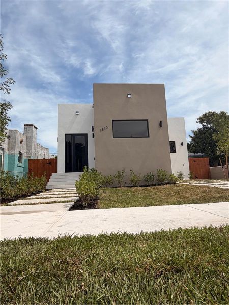 Front exterior of a new home in , Miami, FL, highlighting curb appeal (Image 23). Front exterior of a new home in , Miami, FL, highlighting curb appeal (Image 23).