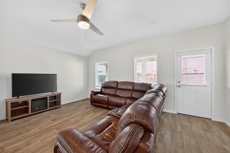 Floor-to-ceiling windows flood the living spaces with natural light, creating a warm and inviting ambiance.