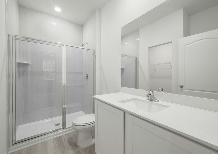 The master bathroom has a large walk in shower