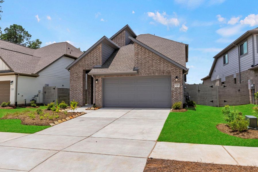 Front exterior of a new home in Two Step Farm, Montgomery, TX, highlighting curb appeal (Image 23). Front exterior of a new home in Two Step Farm, Montgomery, TX, highlighting curb appeal (Image 23).