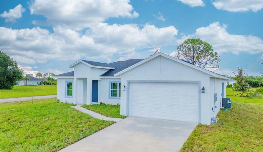 Front exterior of a new home in , Placida, FL, highlighting curb appeal (Image 22). Front exterior of a new home in , Placida, FL, highlighting curb appeal (Image 22).
