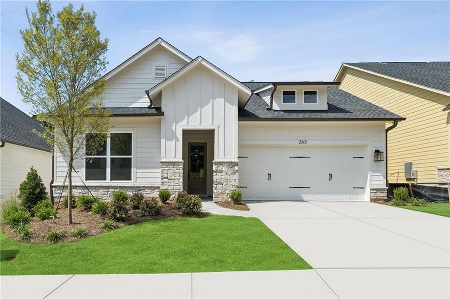 Front exterior of a new home in Maple Grove at Towne Lake, Woodstock, GA, highlighting curb appeal (Image 1). Front exterior of a new home in Maple Grove at Towne Lake, Woodstock, GA, highlighting curb appeal (Image 1).