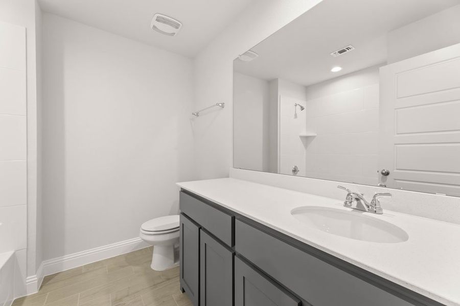 Front exterior of a new home in Main Street Village, Mansfield, TX, highlighting curb appeal (Image 24). Front exterior of a new home in Main Street Village, Mansfield, TX, highlighting curb appeal (Image 24).