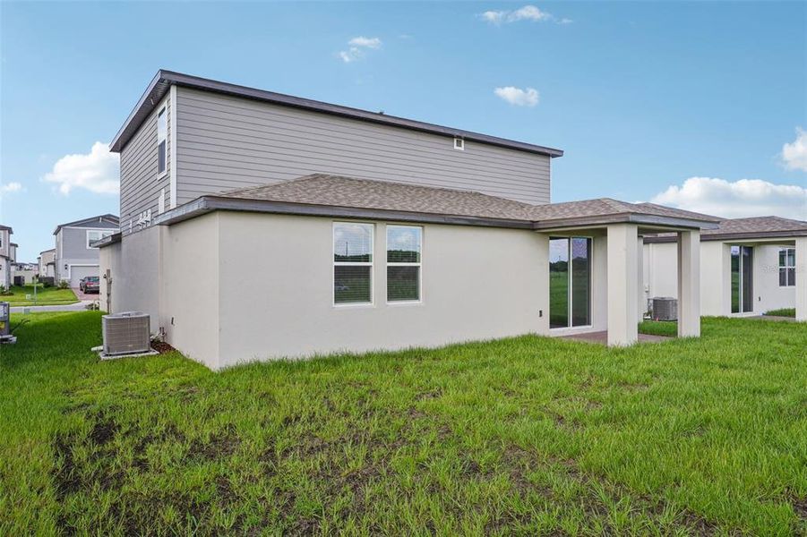 Exterior details and patio area of a home in The Meadow at Crossprairie, St. Cloud (Image 24).