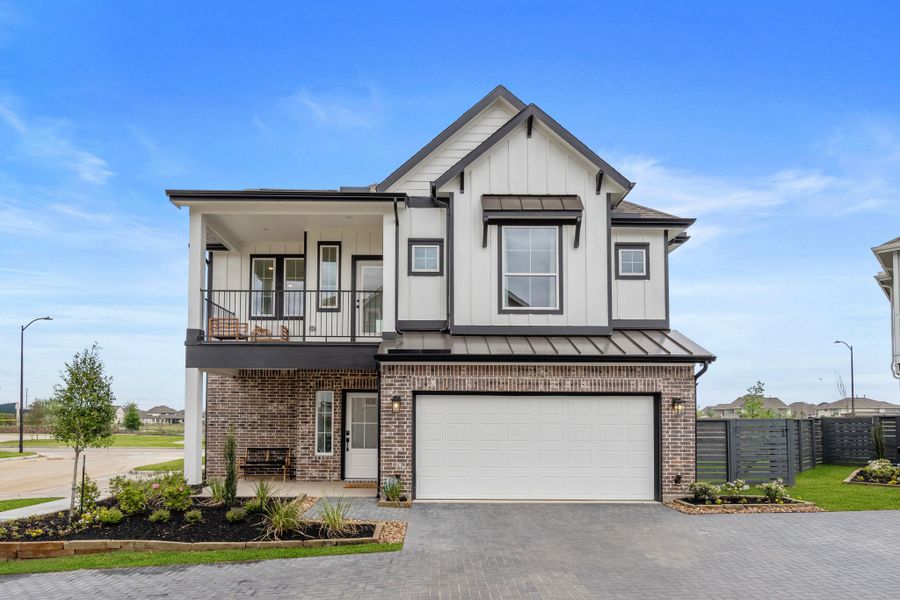 Front exterior of a new home in Bridgeland, Cypress, TX, highlighting curb appeal (Image 23). Front exterior of a new home in Bridgeland, Cypress, TX, highlighting curb appeal (Image 23).