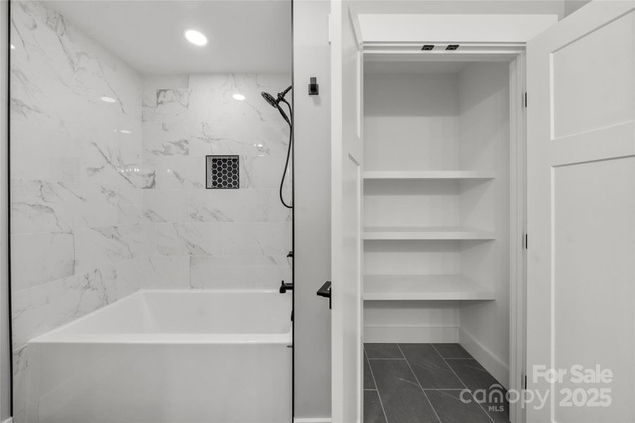 Spacious bath with large linen closet